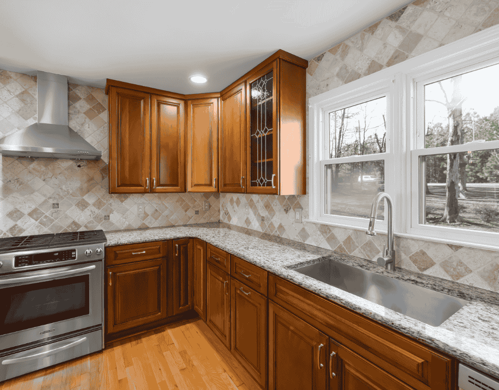 Custom kitchen renovation featuring sleek countertops and wooden cabinets by Creatively Done Homes Improvements Inc.