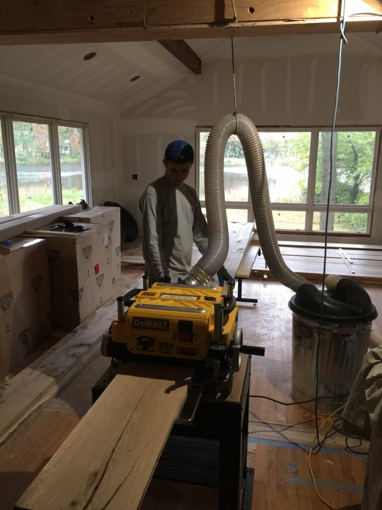 On site Mill Setup with Dewalt Planer During White Oak Beam Wrapping in Sea Cliff Ny by Creatively Done Homes Improvements