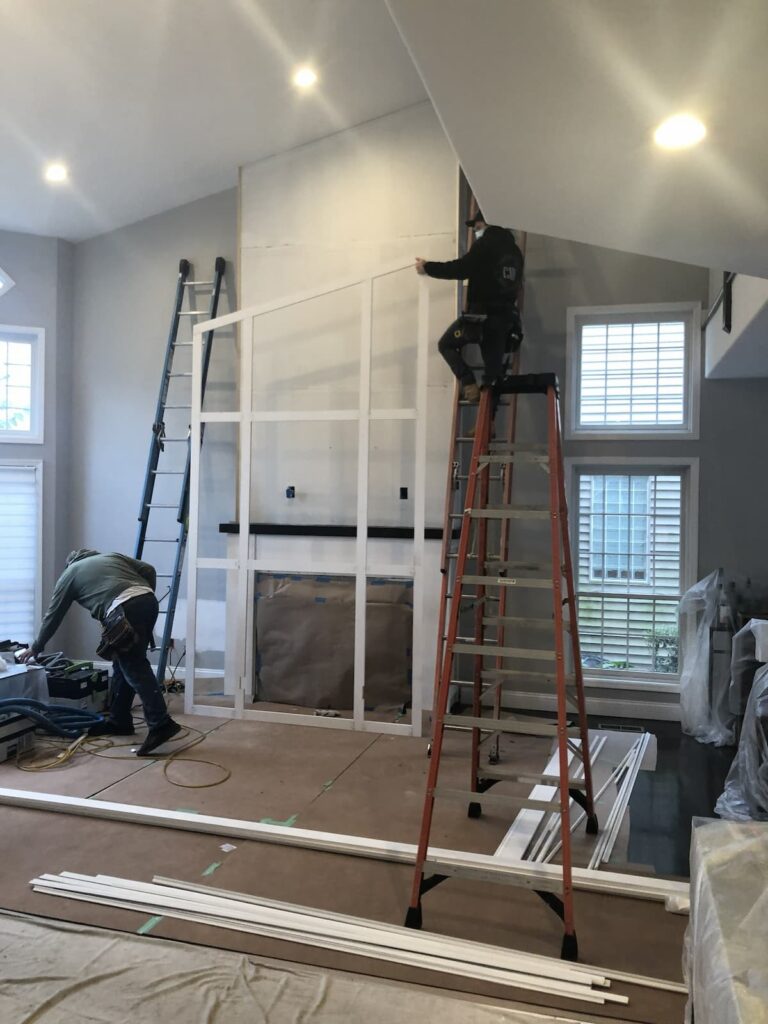 Poplar Wainscoting Frame Mounted on Plainview Ny Fireplace Wall by Creatively Done Homes Improvements