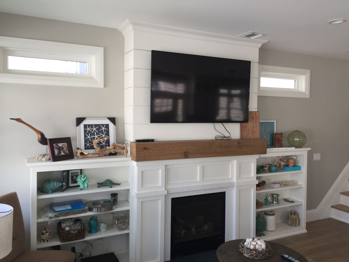 Custom Fireplace Wall with Built in Cabinets Reclaimed White Oak Mantel and Shiplap in Merrick Ny by Creatively Done Homes Improvements